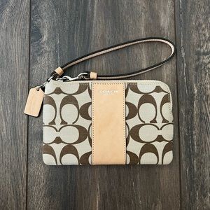 Brown and tan Coach wristlet
